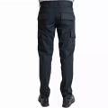 Back view of black cargo pants with rear and thigh pockets, worn with sturdy shoes under a white top edge visible at the waist.